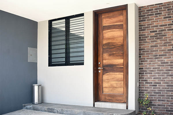 Decorative wood residential entrance door.